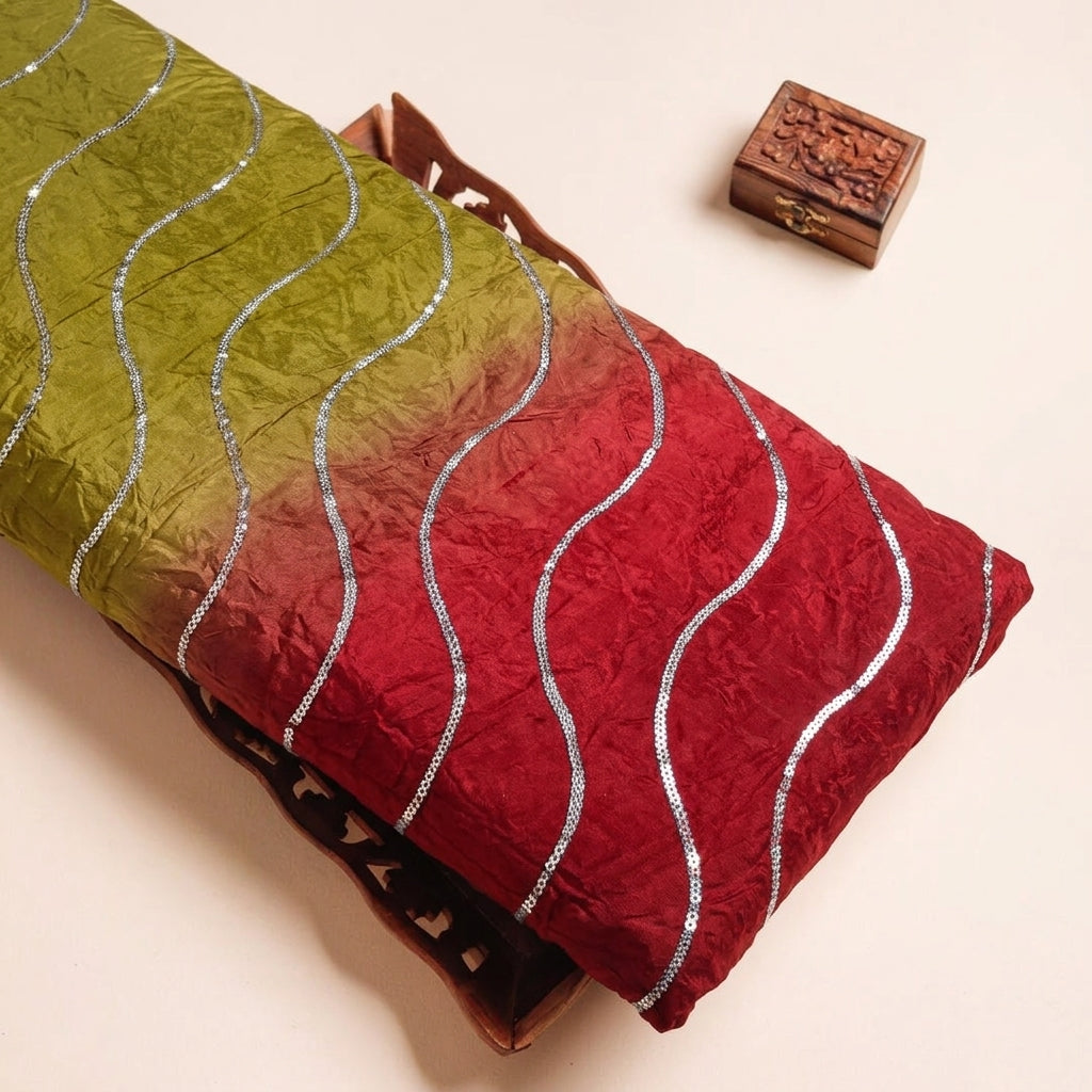 Two Toned Red Yellow Two Toned Crepe Fabric on a wooden tray