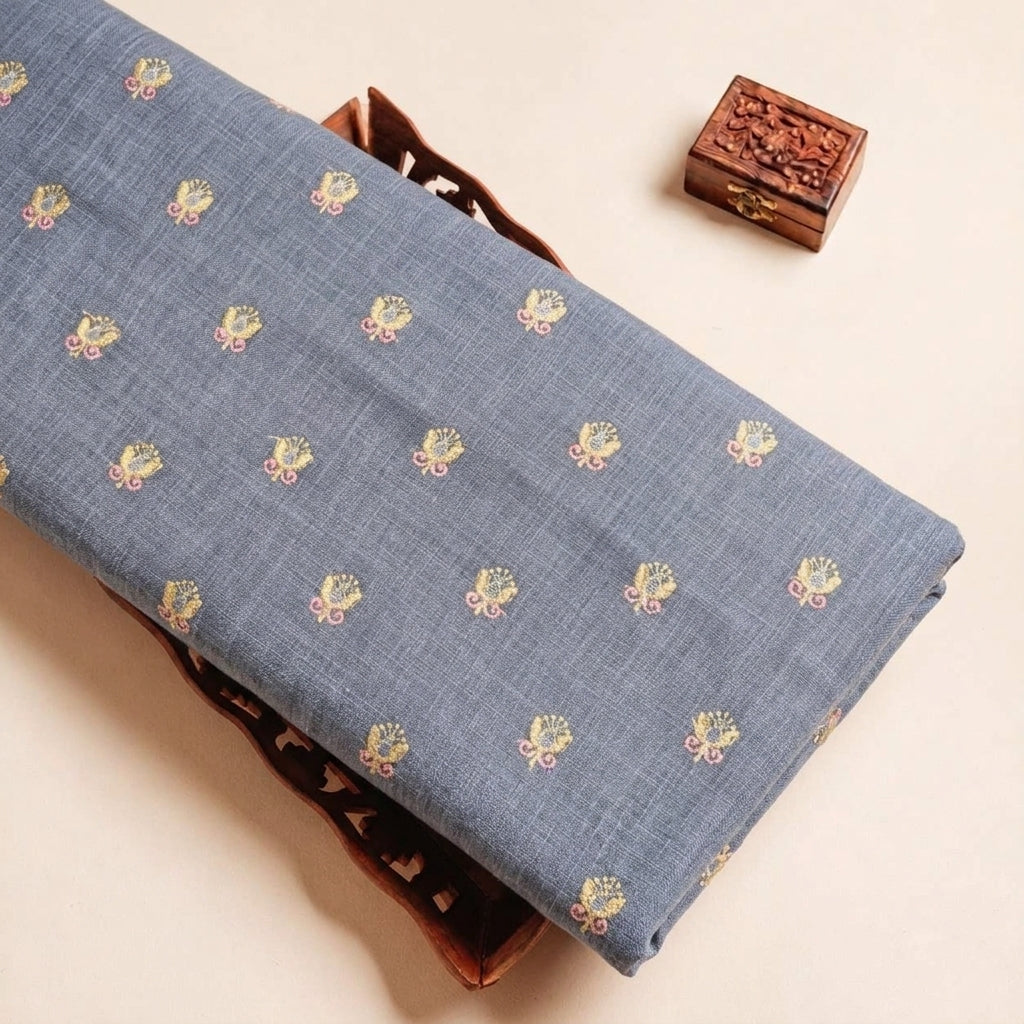 Folded Blue Embroidery Linen Fabric Highlighting Sequin Floral and Texture