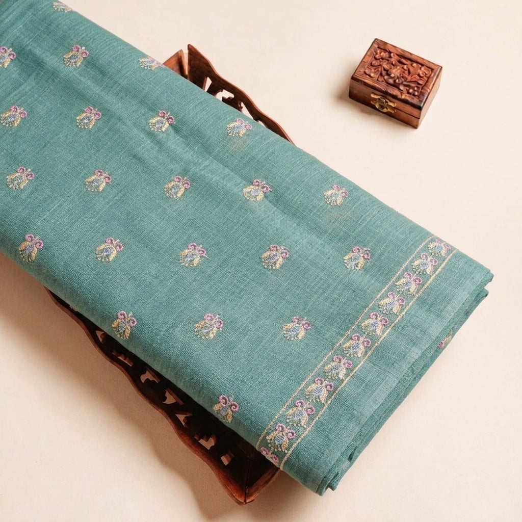 Folded Green Embroidery Linen Fabric Highlighting Sequin Floral and Texture