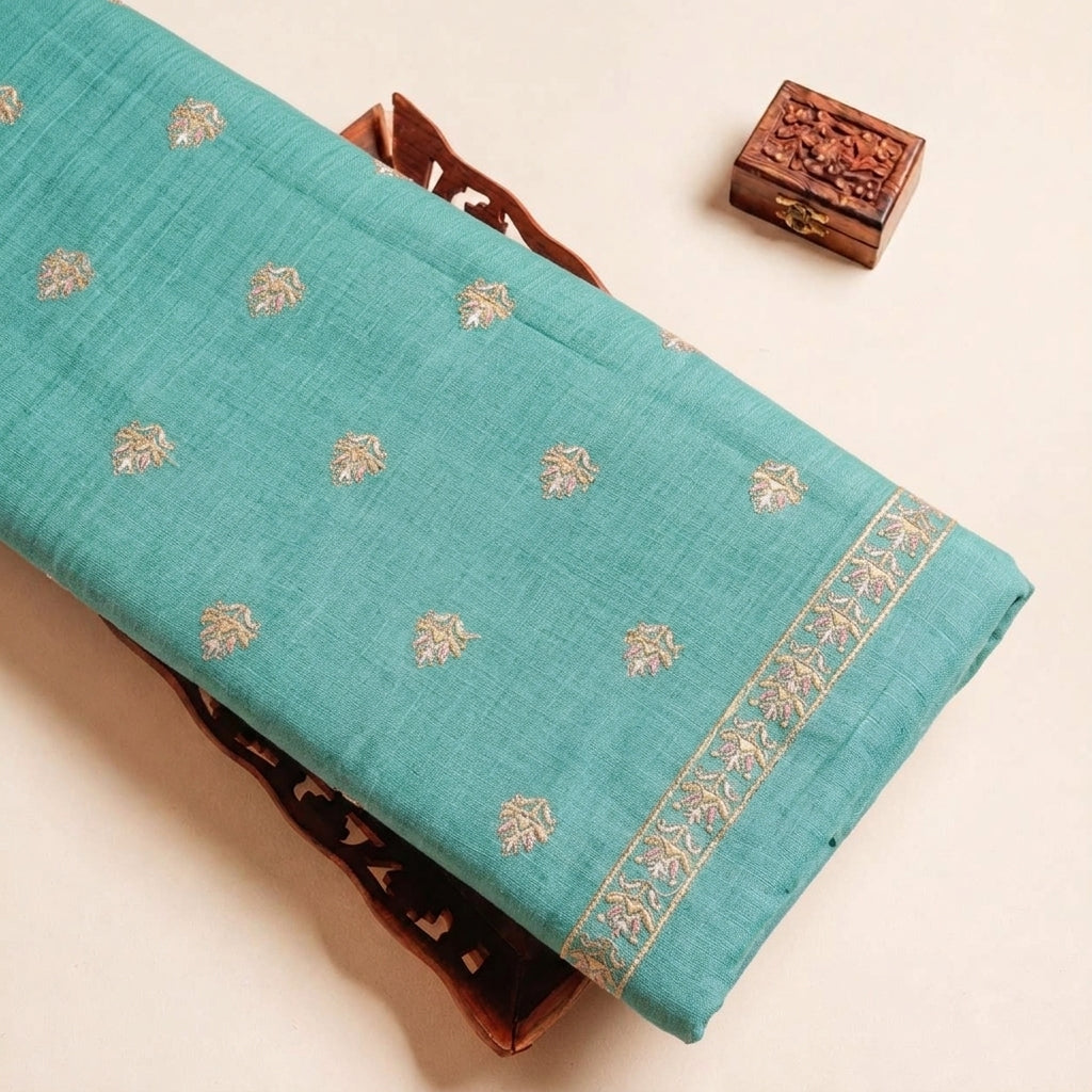Folded Blue Embroidery Linen Fabric Highlighting Sequin Floral and Texture