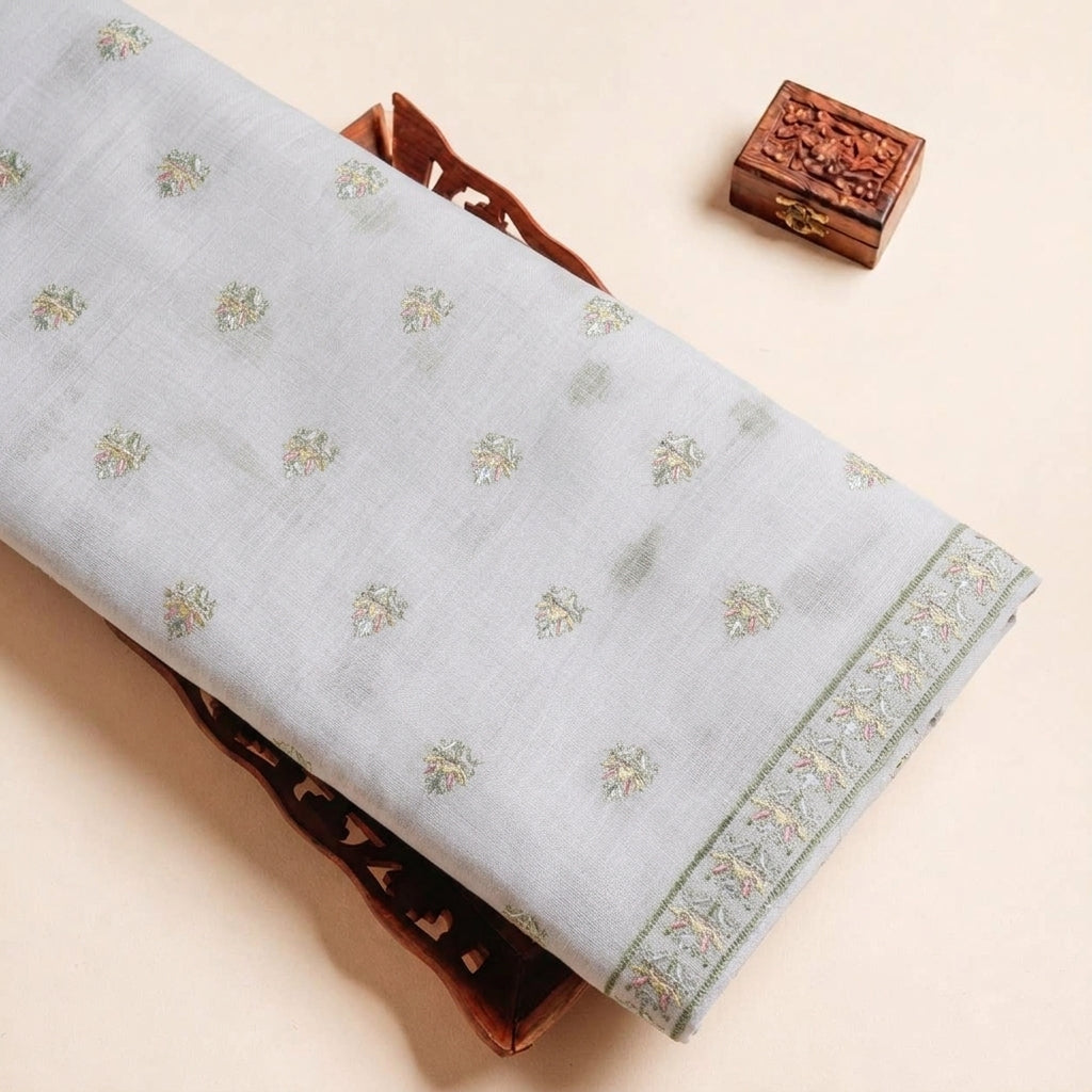 Folded White Embroidery Linen Fabric Highlighting Floral Sequin and Texture