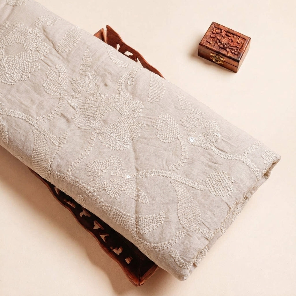 Folded Beige Embroidery Tussar Fabric Highlighting Silk Thread Work Sequin and Texture