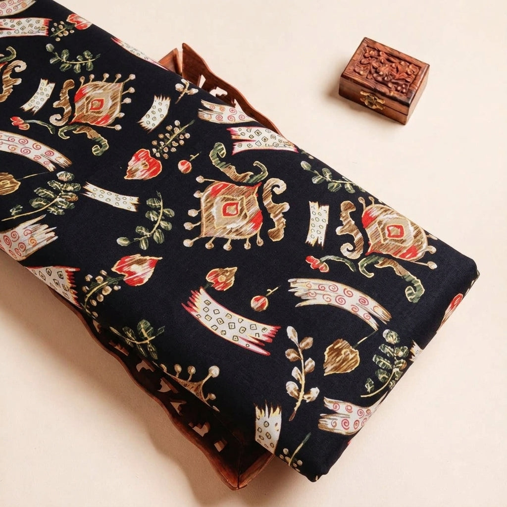Folded Black Floral Rayon Fabric Highlighting Foil and Texture