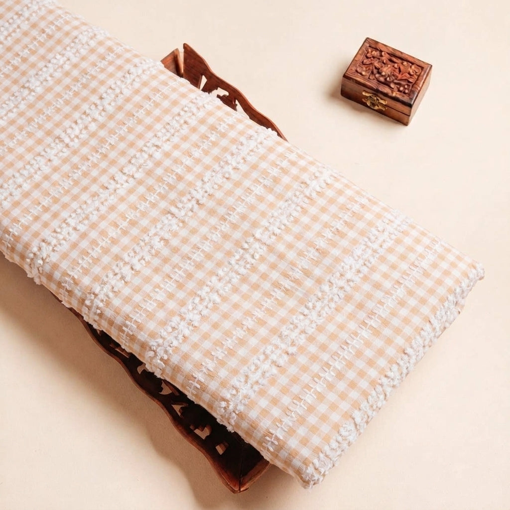 Folded Peach Embroidery Cotton Fabric Highlighting Checked Thread Work and Texture
