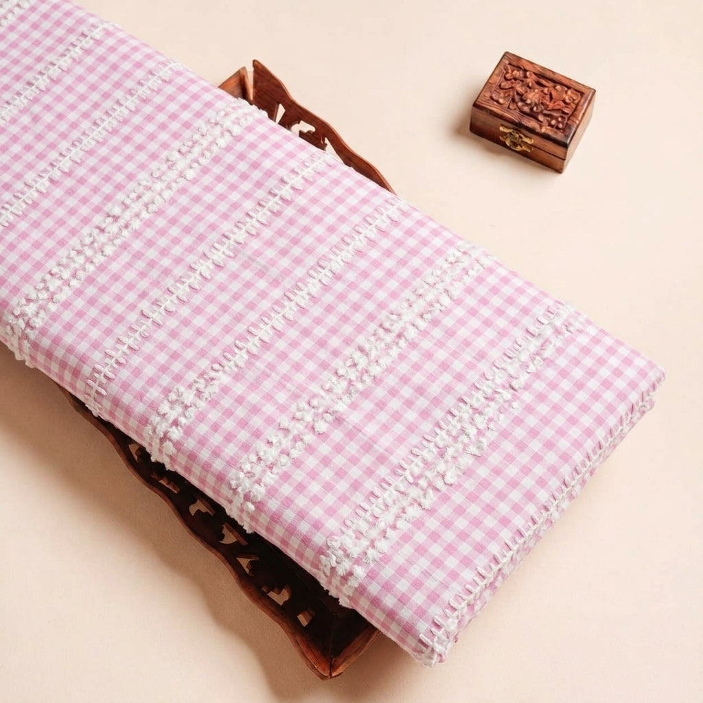 Folded Pink Embroidery Cotton Fabric Highlighting Checked Thread Work and Texture