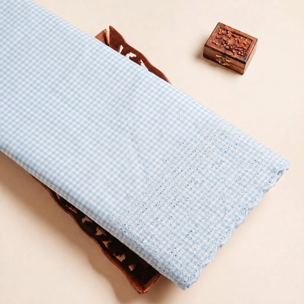 Folded Blue Embroidery Cotton Fabric Highlighting Checked Thread Work Border and Texture