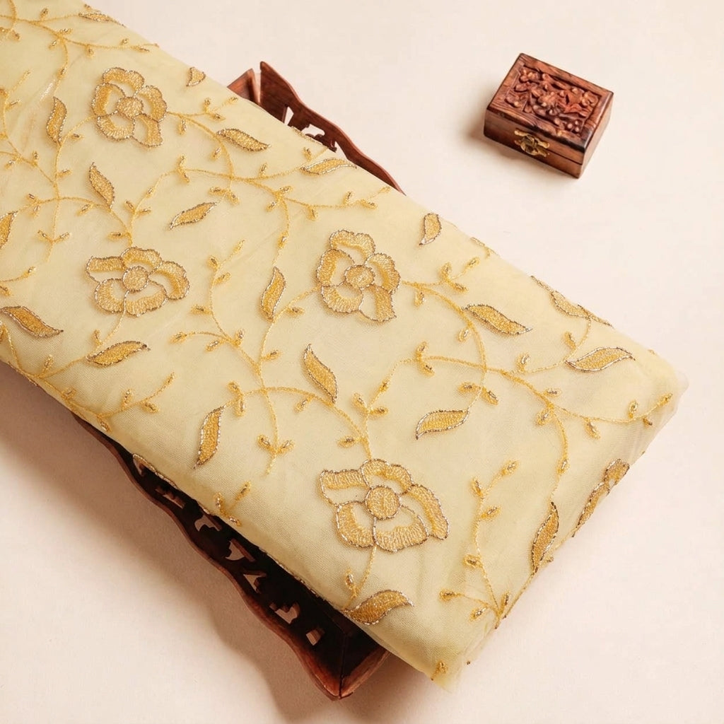 Folded Yellow Embroidery Net Fabric Highlighting Floral and Texture