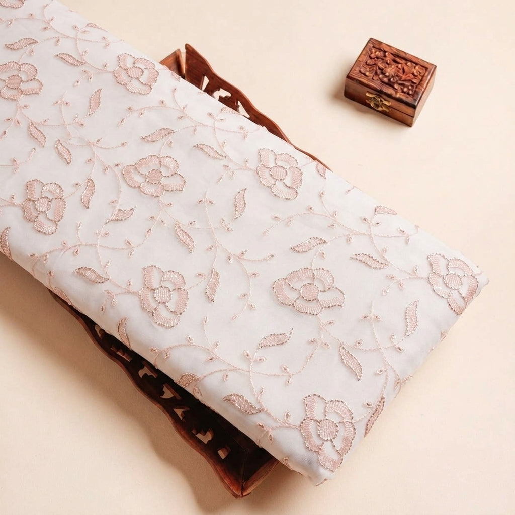 Folded Peach Embroidery Net Fabric Highlighting Floral Stone and Texture