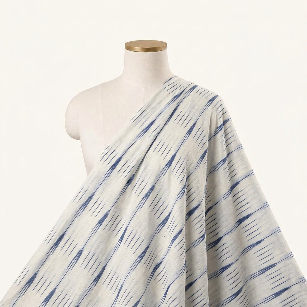 Ikat Cream Ikat Cotton Fabric Draped as a saree
