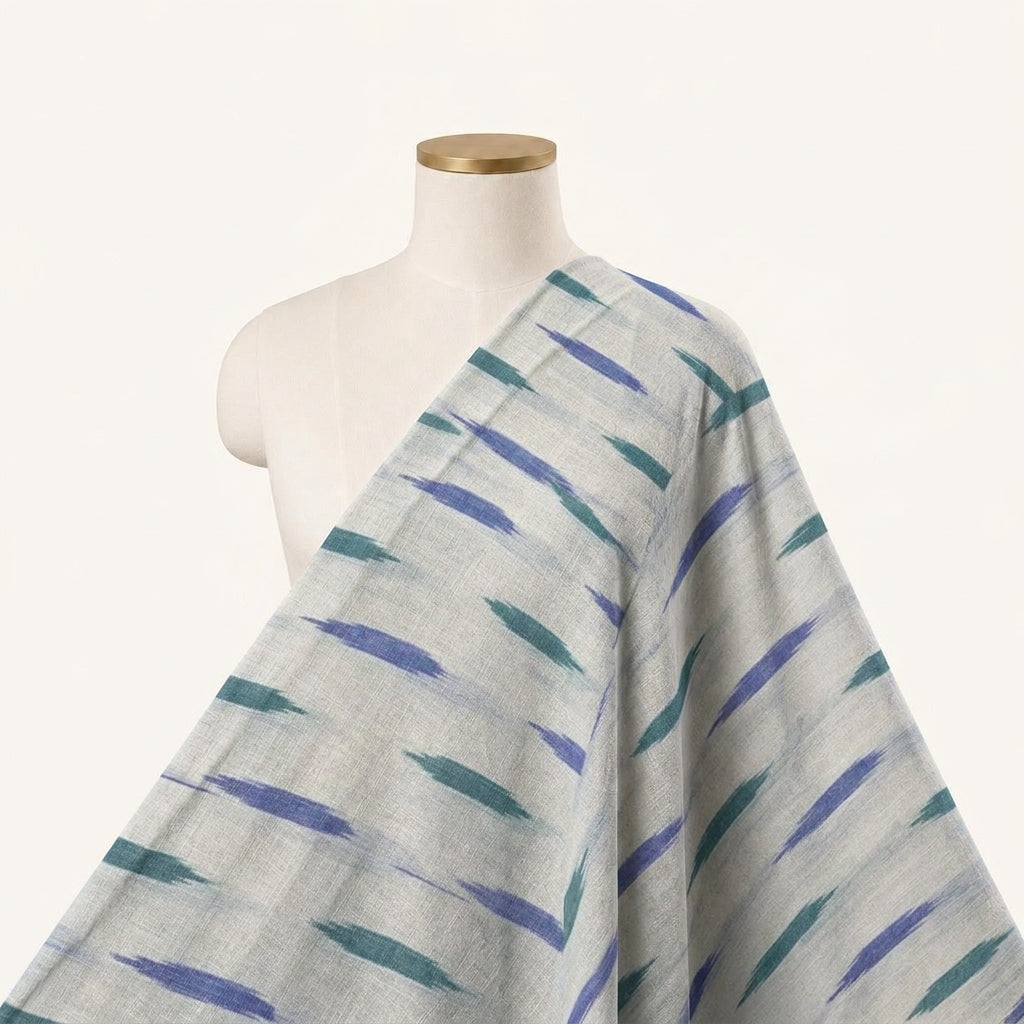 Ikat Cream Ikat Cotton Fabric Draped as a saree