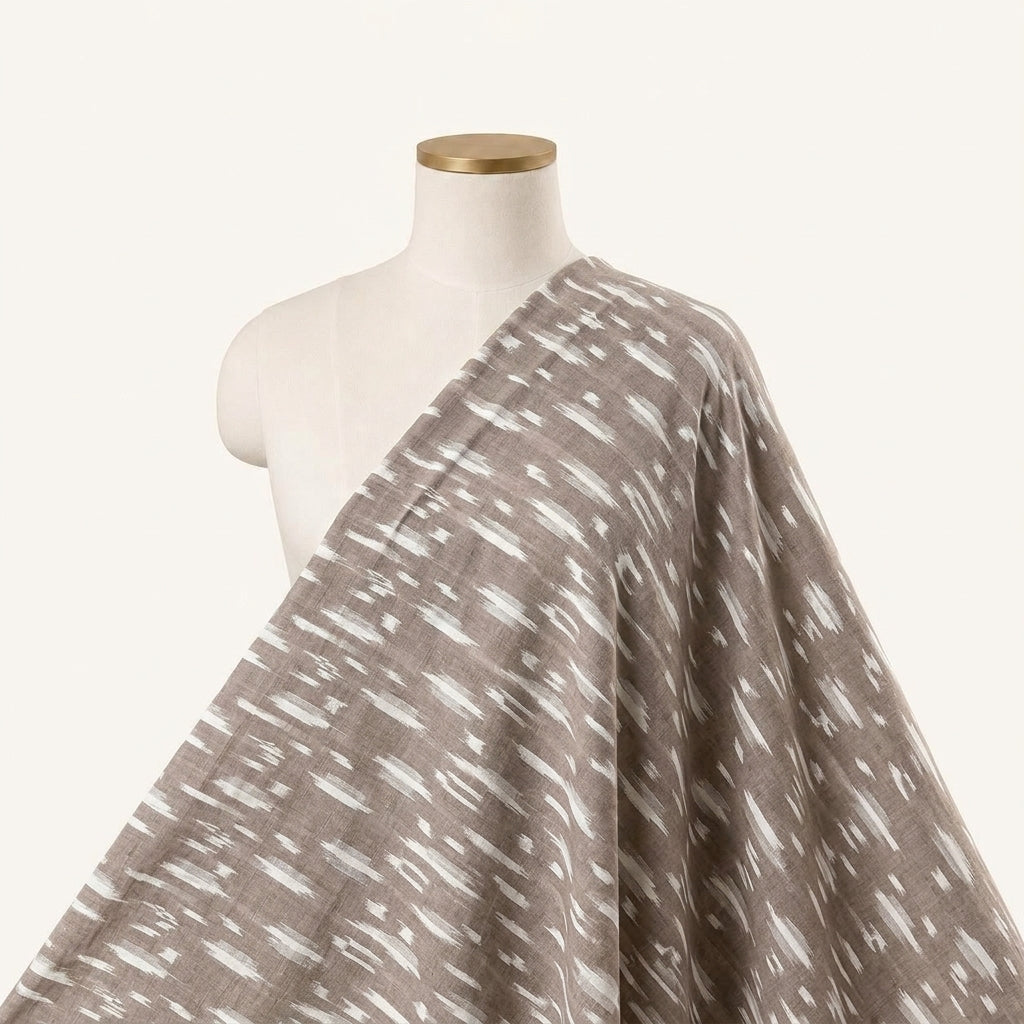 Ikat Brown Ikat Cotton Fabric Draped as a saree