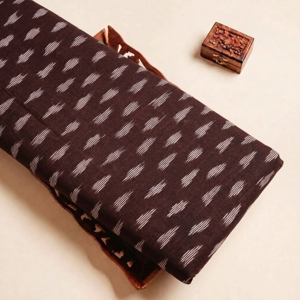 Folded Maroon Ikat Cotton Fabric Highlighting and Texture
