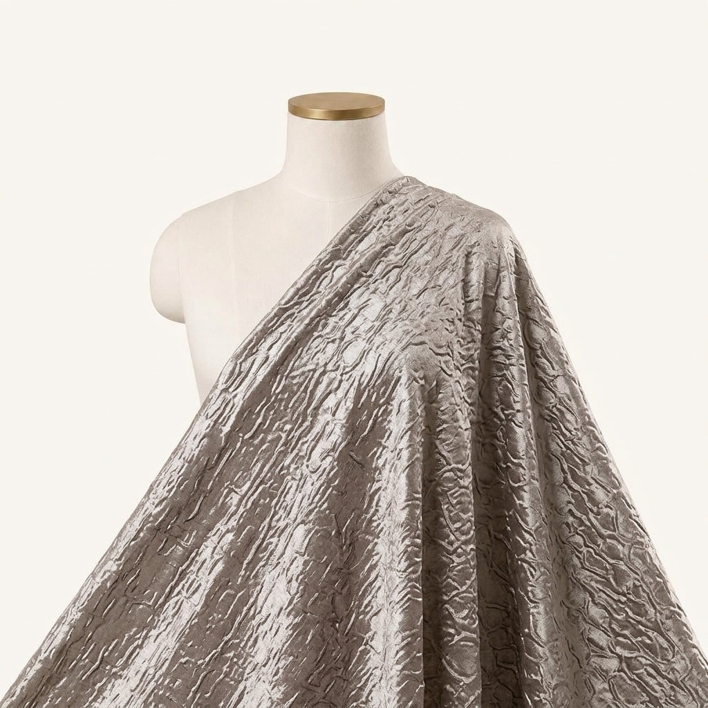 Embossed Foil Brown Embossed Foil Crepe Fabric Draped as a saree