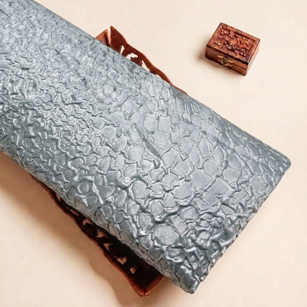 Folded Blue Embossed Foil Crepe Fabric Highlighting Crushed and Texture