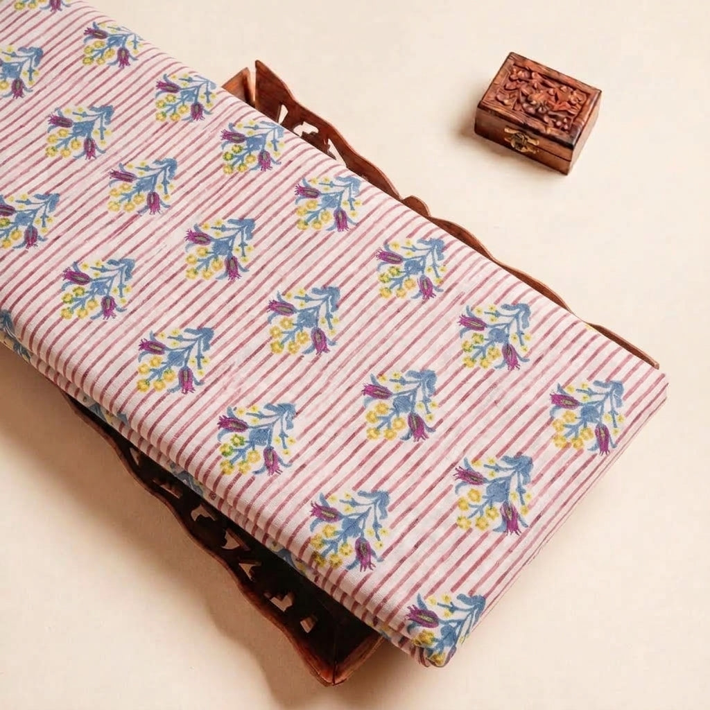Folded Pink Floral Linen Fabric Highlighting Stripes and Texture