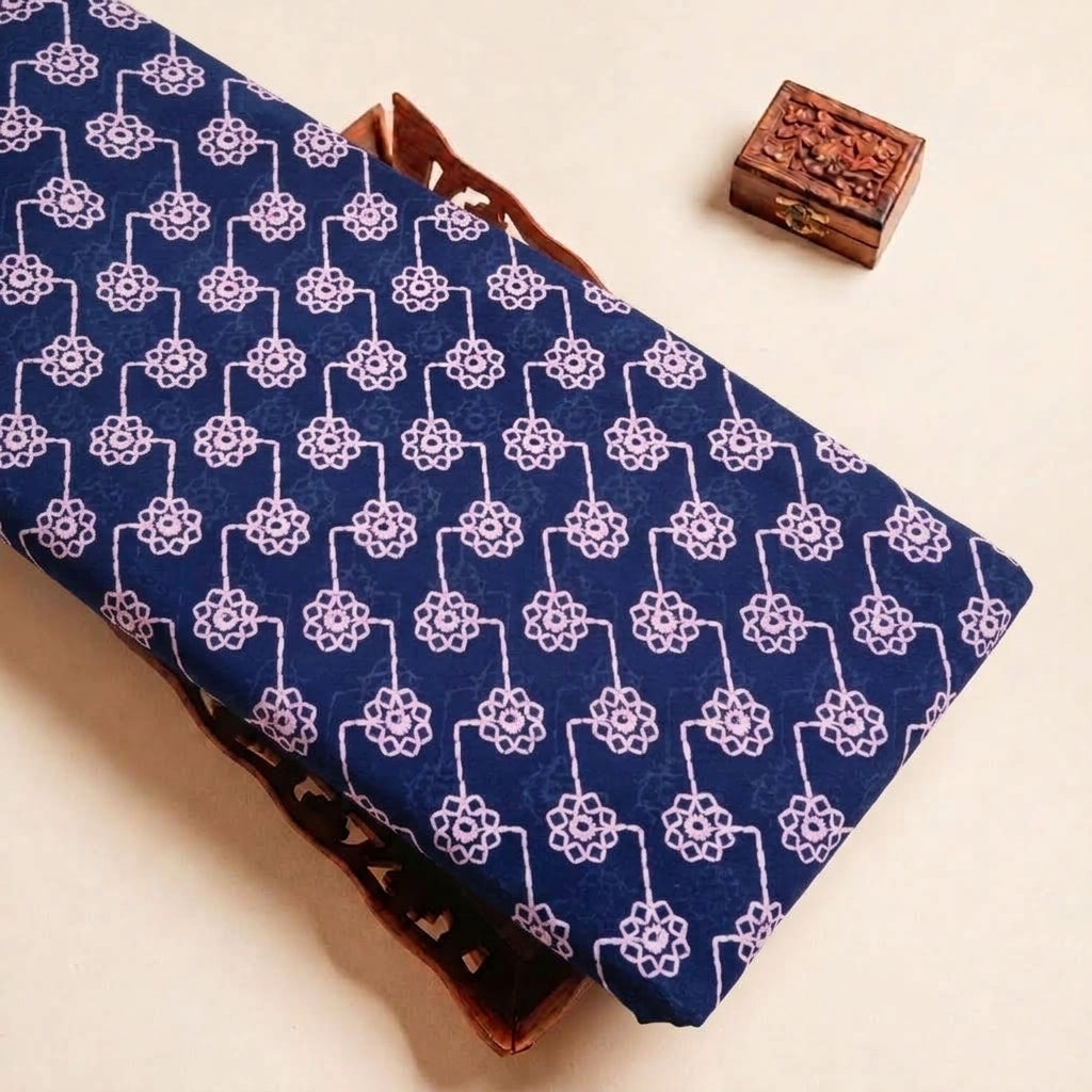 Folded Navy Blue Embroidery Cotton Fabric Highlighting Floral Thread Work and Texture