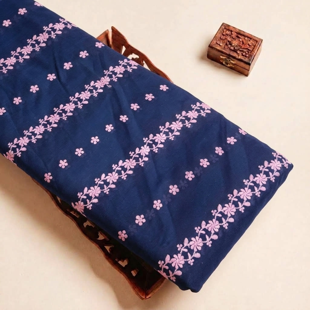 Folded Navy Blue Embroidery Cotton Fabric Highlighting Floral Thread Work Border and Texture