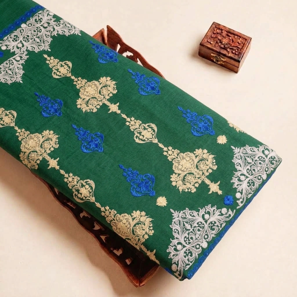 Folded Green Embroidery Cotton Fabric Highlighting Thread Work Border and Texture