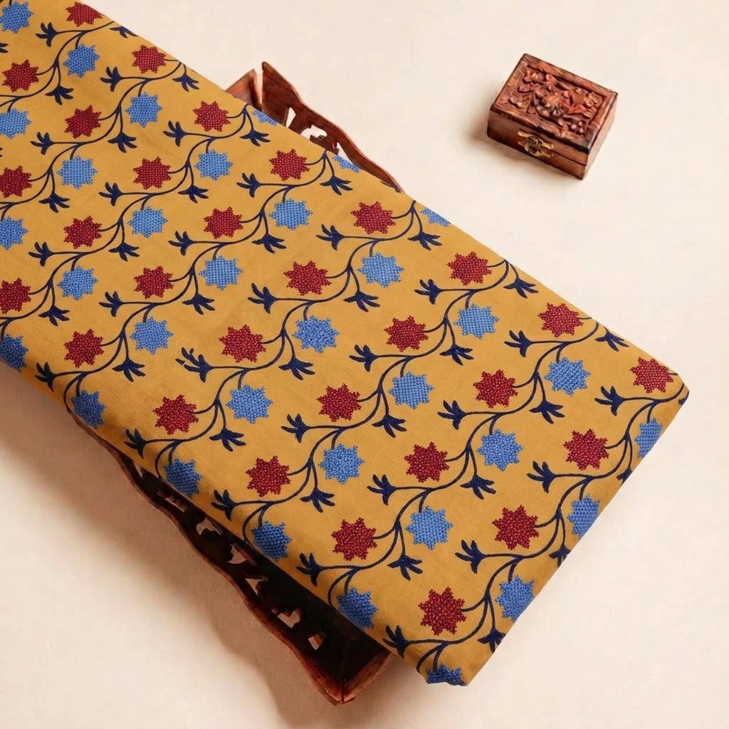Folded Orange Embroidery Cotton Fabric Highlighting Floral Thread Work and Texture