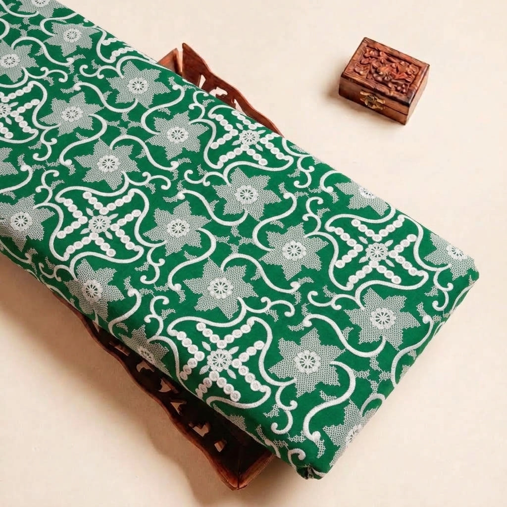 Folded Green Embroidery Cotton Fabric Highlighting Floral Thread Work and Texture