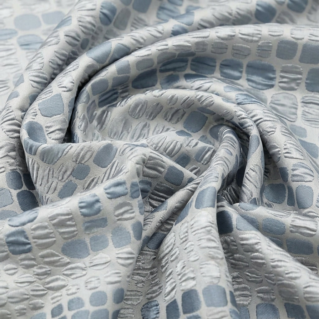 Swirled Silver Blue Embossed Organza Fabric Showing Abstract and Drape