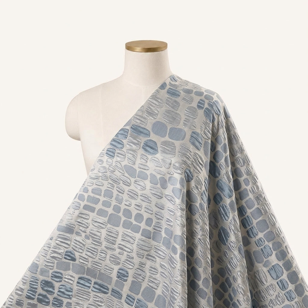 Embossed Silver Blue Embossed Organza Fabric Draped as a saree