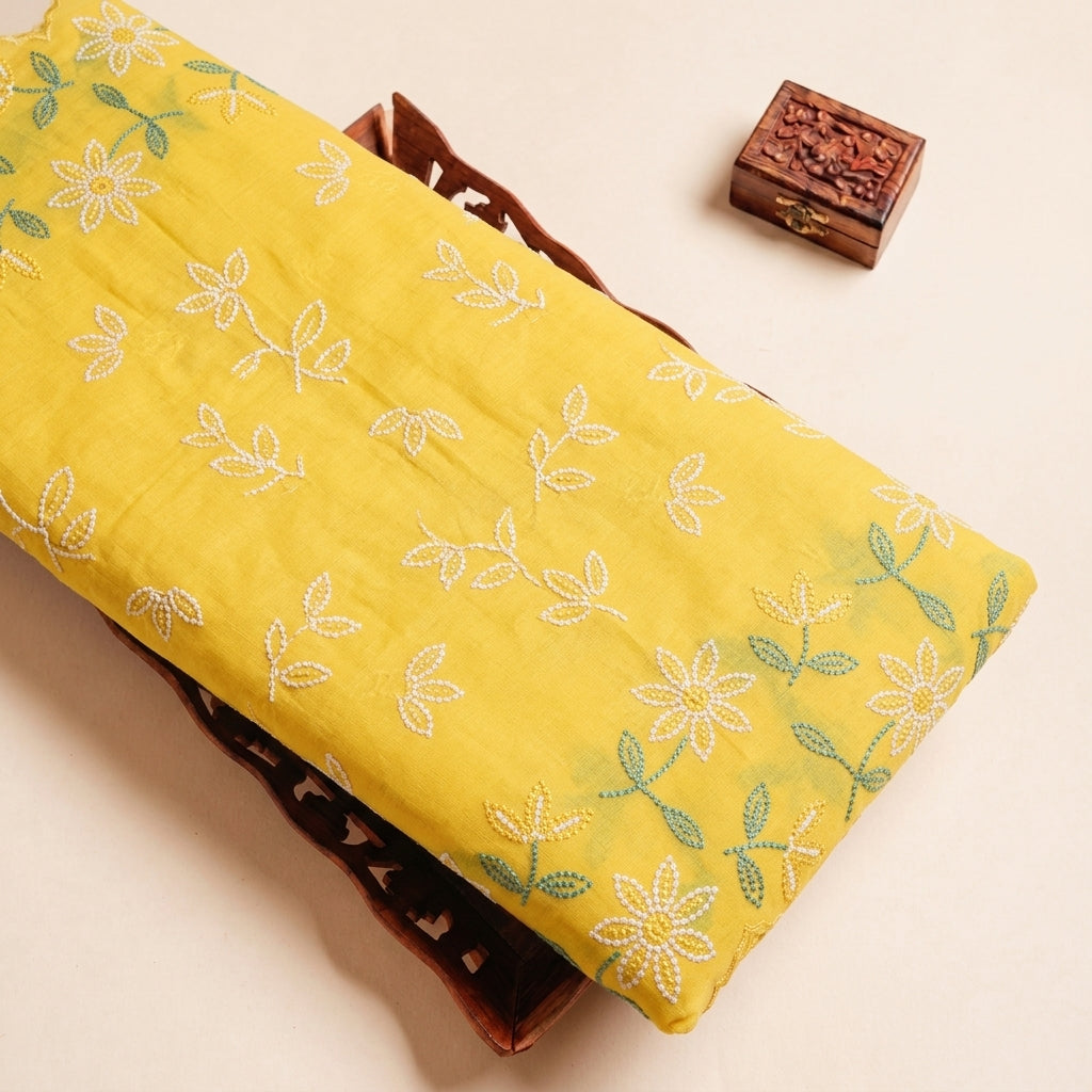 Folded Yellow Embroidery Cotton Fabric Highlighting Border Floral and Texture