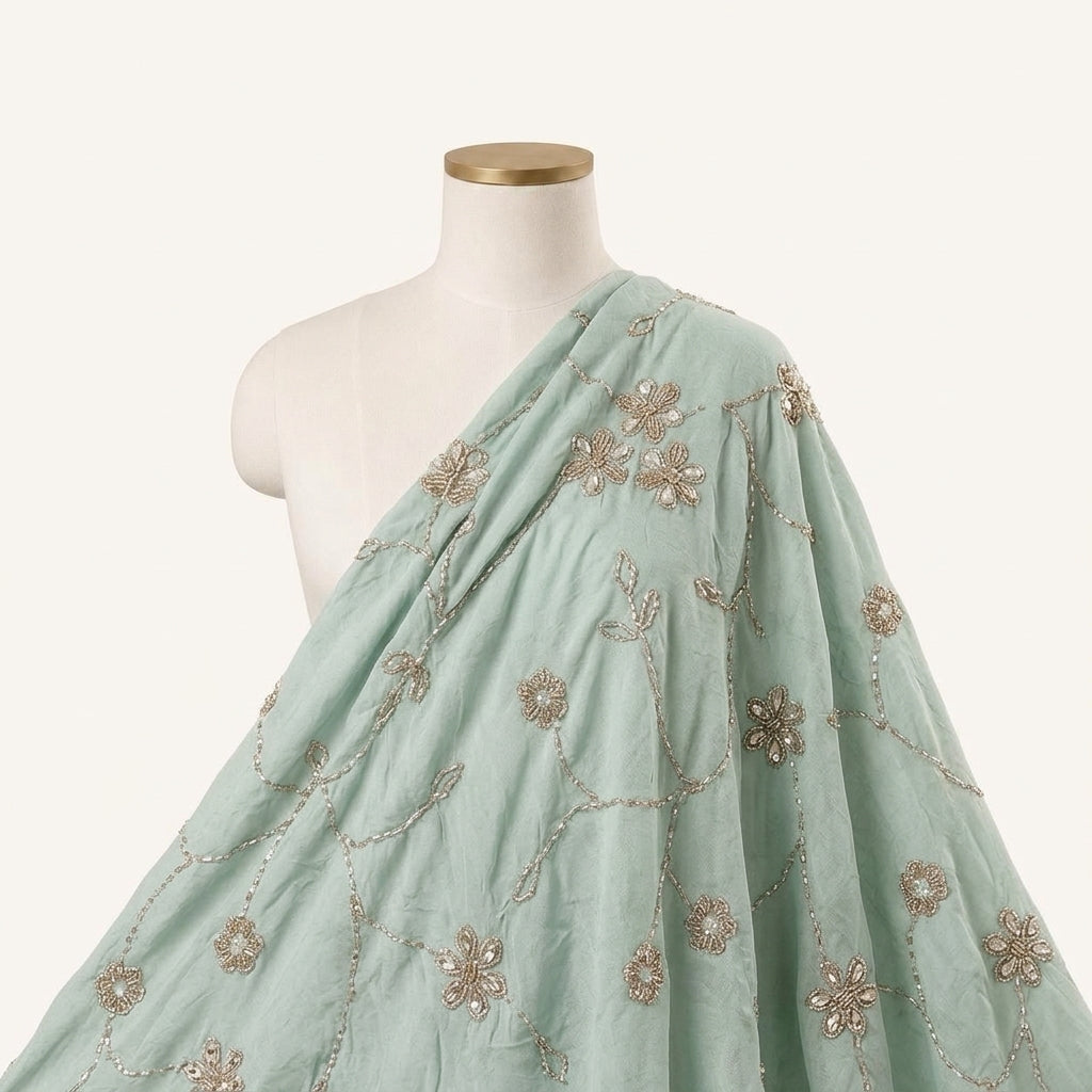 Light Blue Embroidery Organza Fabric, draped as a saree