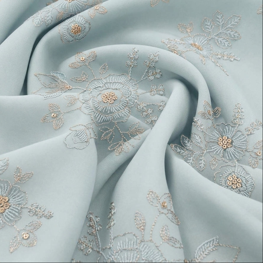 Swirled Light Blue Embroidery Tissue Fabric Showing Floral Sequin Thread Work and Drape
