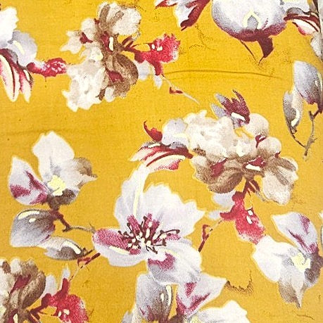 Yellow Foil Print Rayon Fabric, laid flat