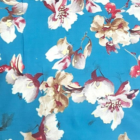 Blue Foil Print Rayon Fabric, laid flat