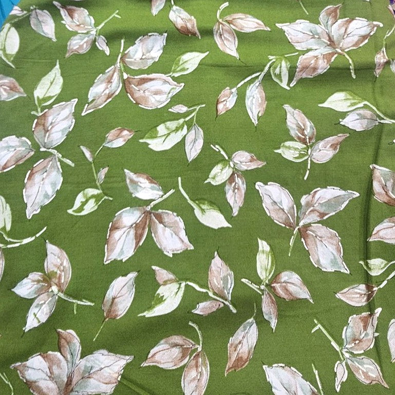 Green Foil Print Rayon Fabric, laid flat