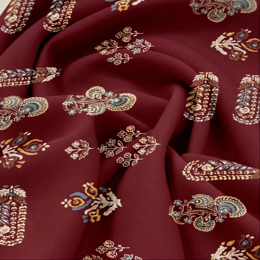 Maroon Foil Print Rayon Fabric, swirled to show the drape