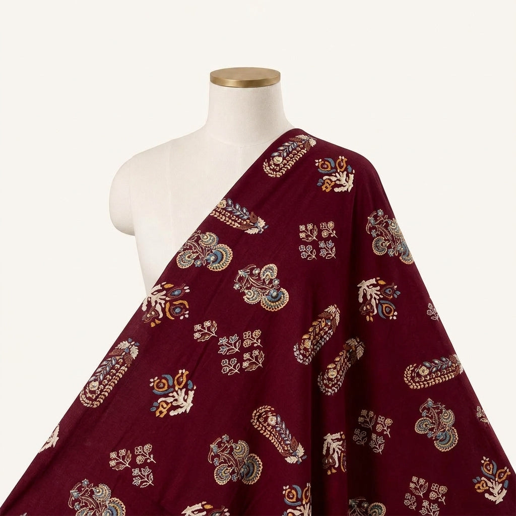 Maroon Foil Print Rayon Fabric, draped as a saree