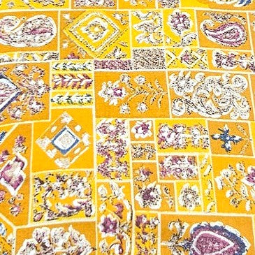 Yellow Paisley Rayon Fabric, laid flat