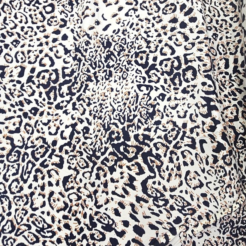 Brown Animal Print Rayon Fabric, laid flat