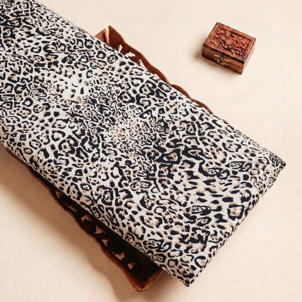 Folded Brown Animal Print Rayon Fabric Highlighting Texture