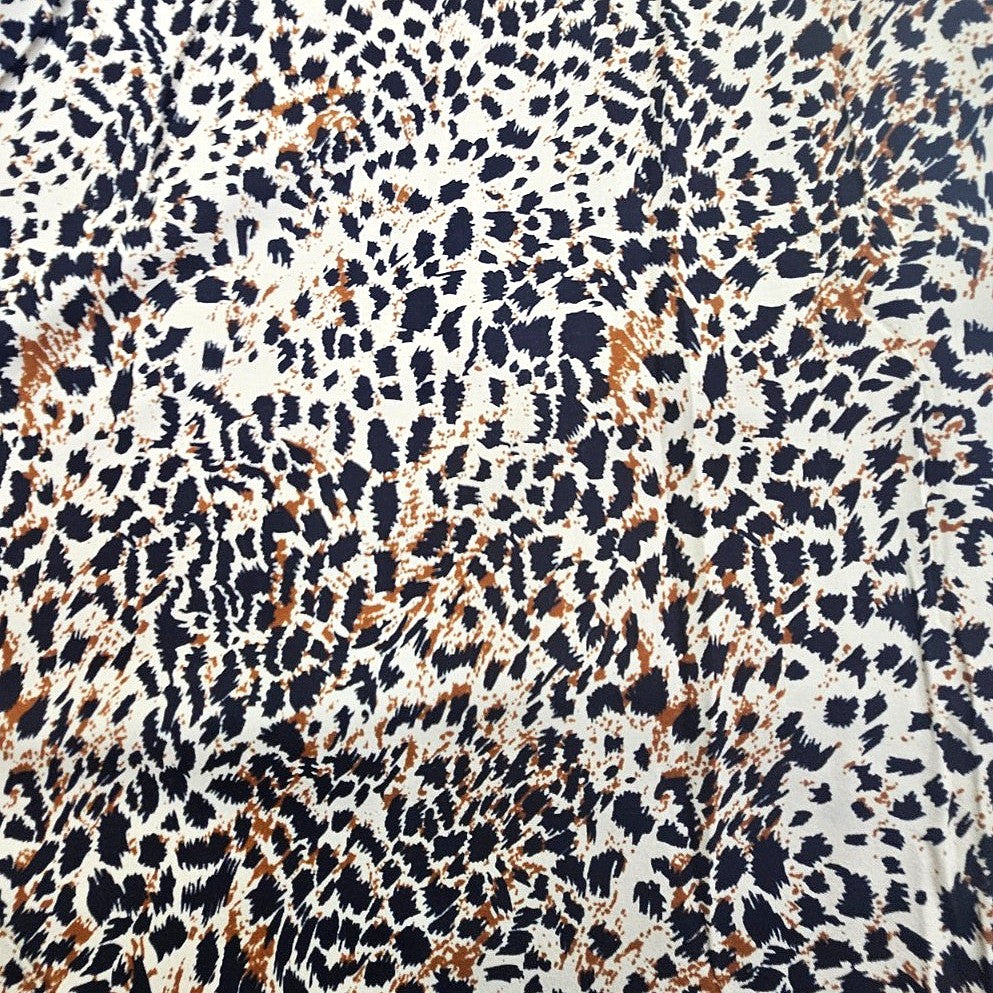 Brown Animal Print Rayon Fabric, laid flat