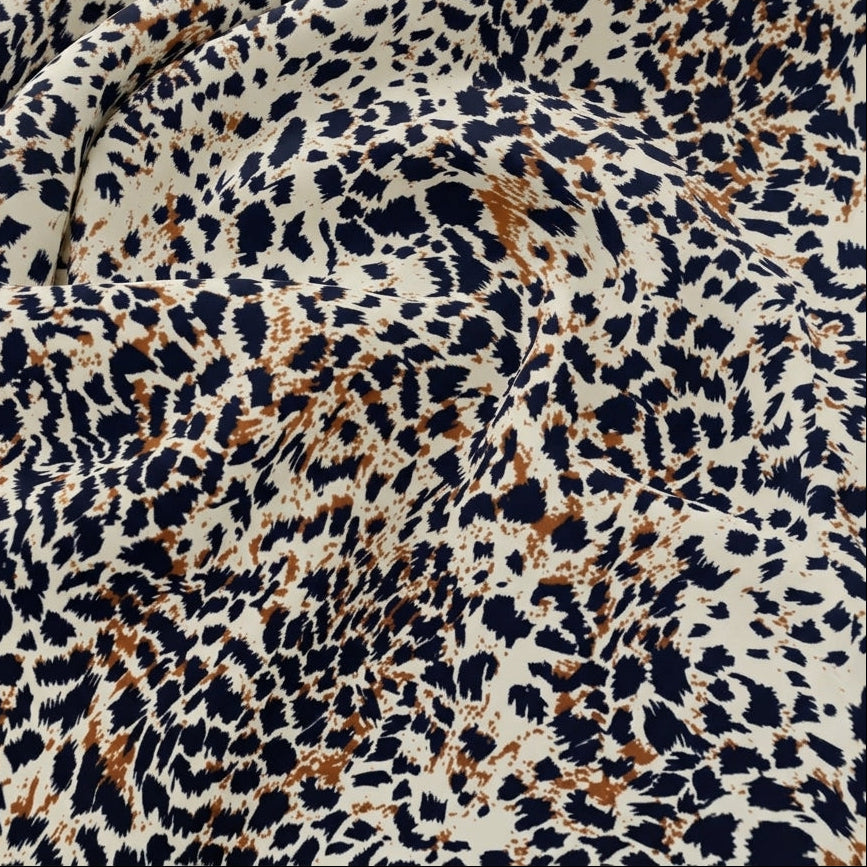 Swirled Brown Animal Print Rayon Fabric Showing Drape