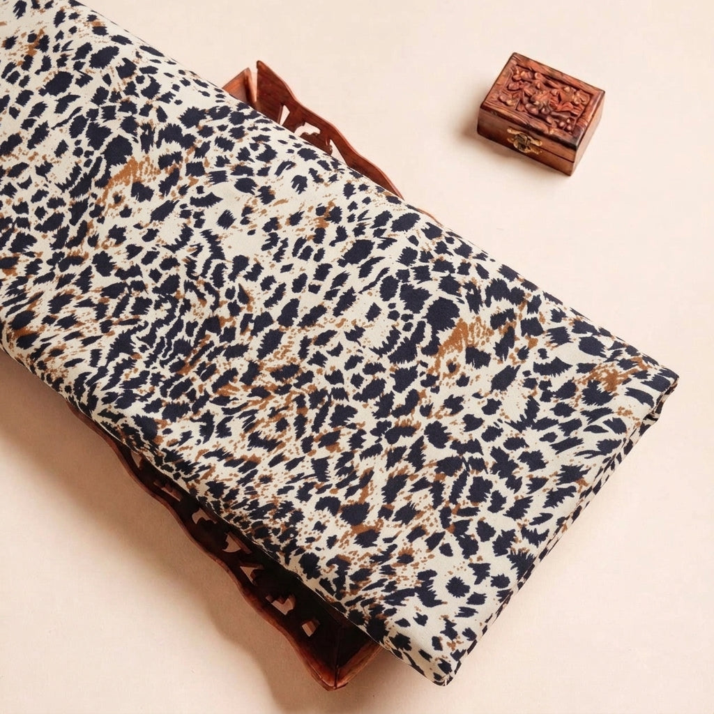 Folded Brown Animal Print Rayon Fabric Highlighting Texture