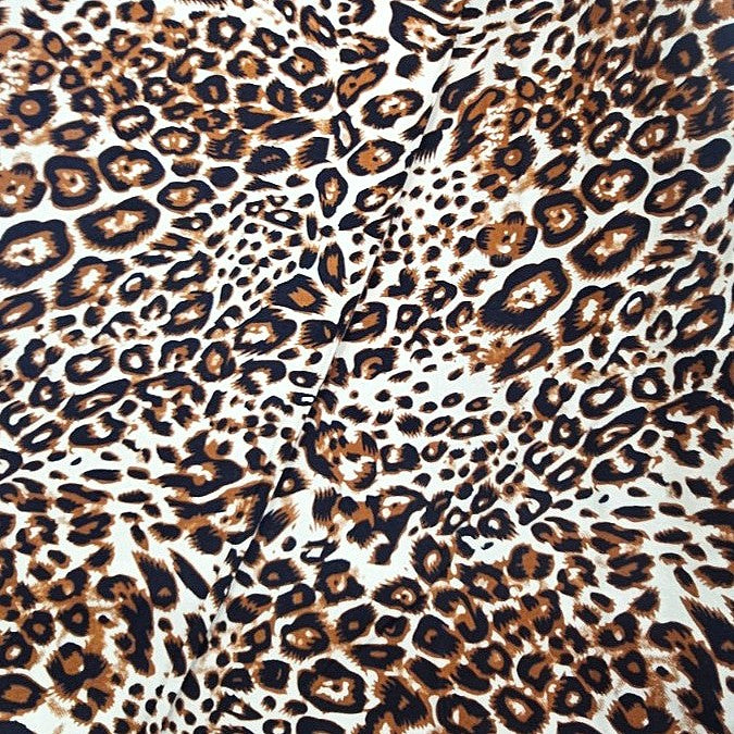 Brown Animal Print Rayon Fabric, laid flat