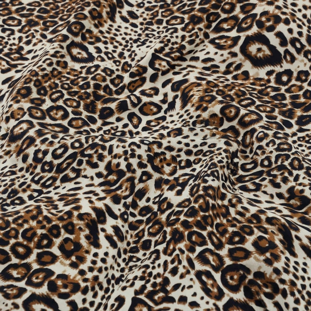 Swirled Brown Animal Print Rayon Fabric Showing Drape