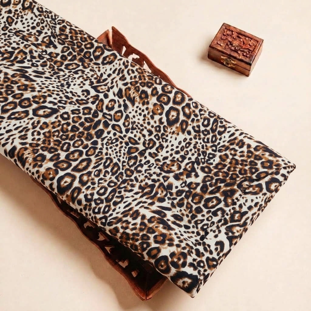Folded Brown Animal Print Rayon Fabric Highlighting Texture
