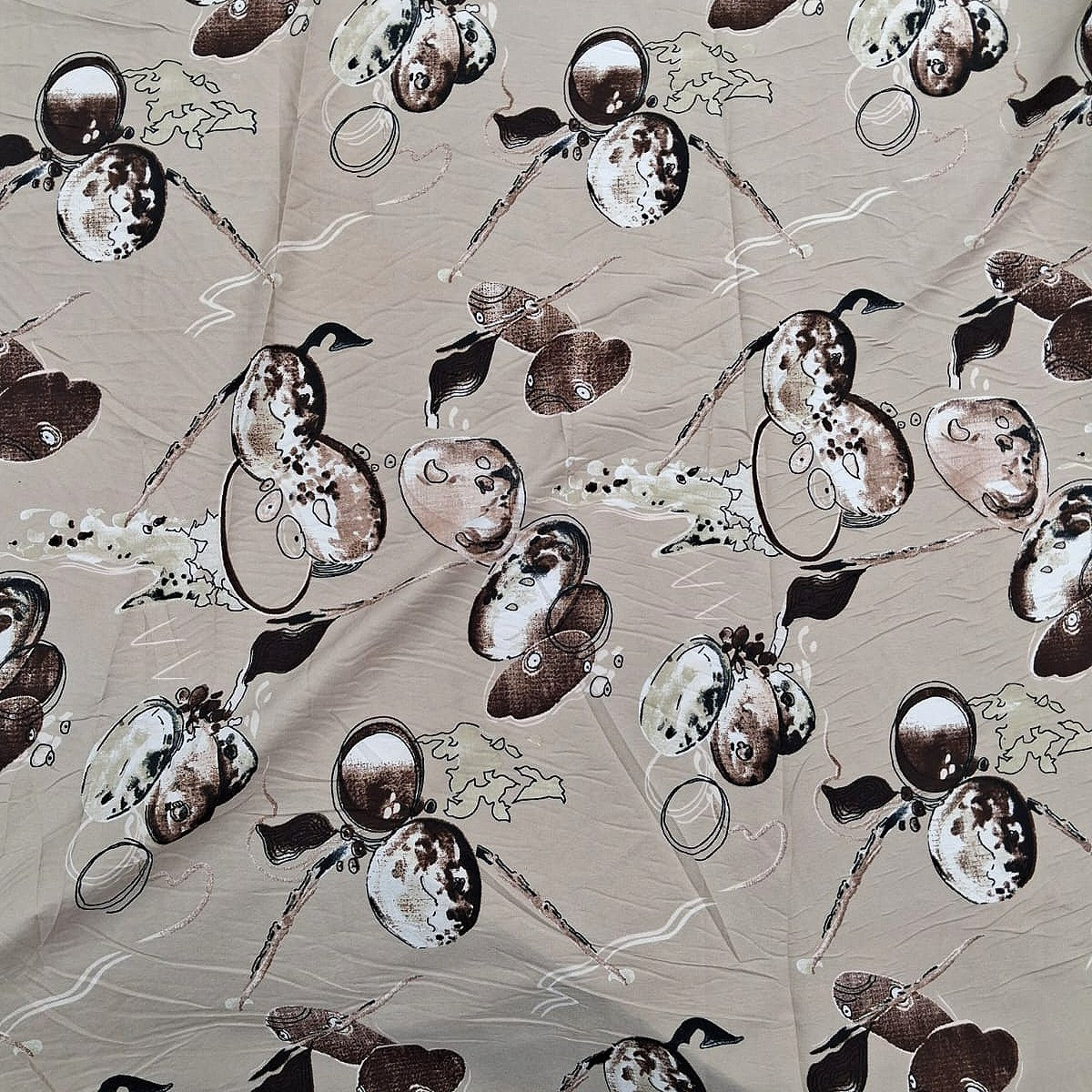 Brown Floral Crepe Fabric, laid flat