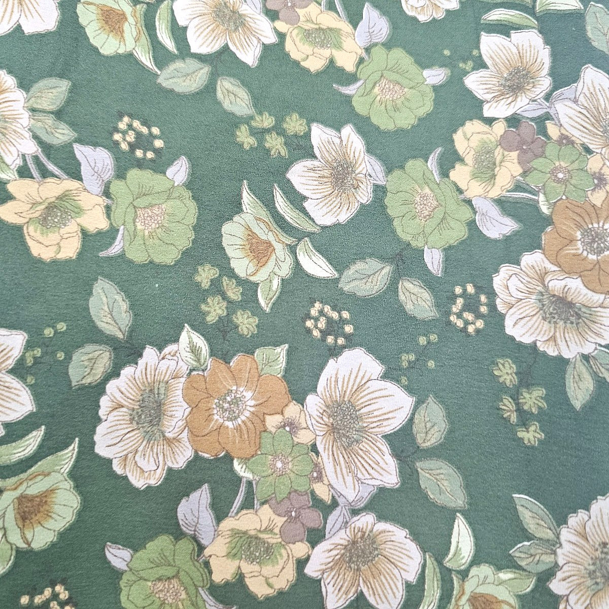Green Floral Crepe Fabric, laid flat