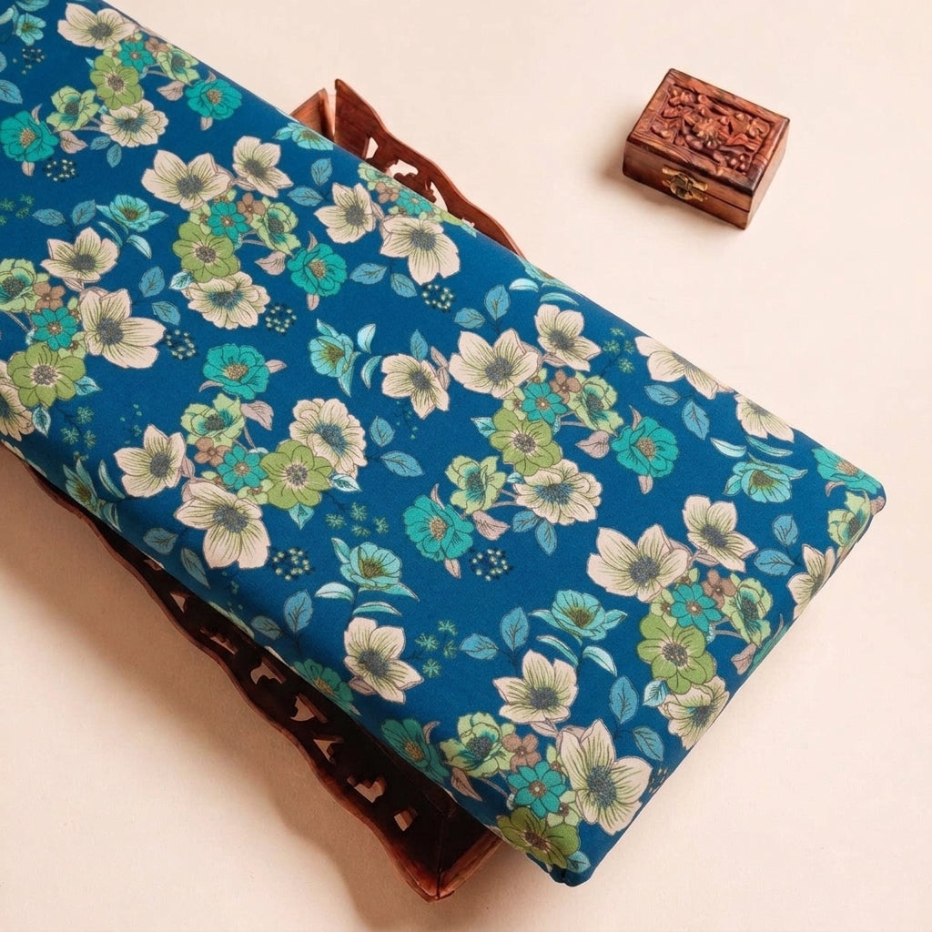 Folded Blue Floral Crepe Fabric Highlighting Texture
