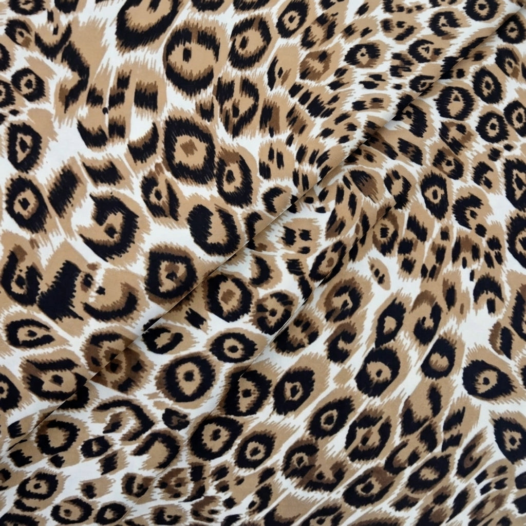 Cream Animal Print Crepe Fabric, folded