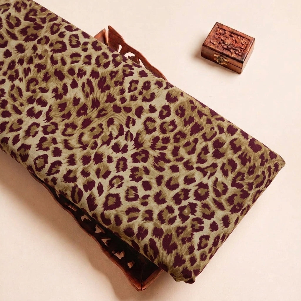 Folded Pink Animal Print Crepe Fabric Highlighting Texture
