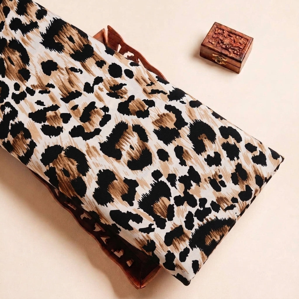 Folded White Animal Print Crepe Fabric Highlighting Texture