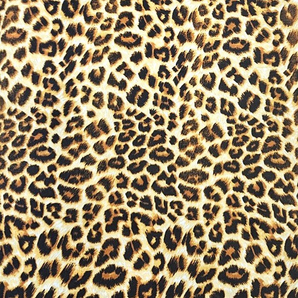 Yellow Animal Print Crepe Fabric, laid flat